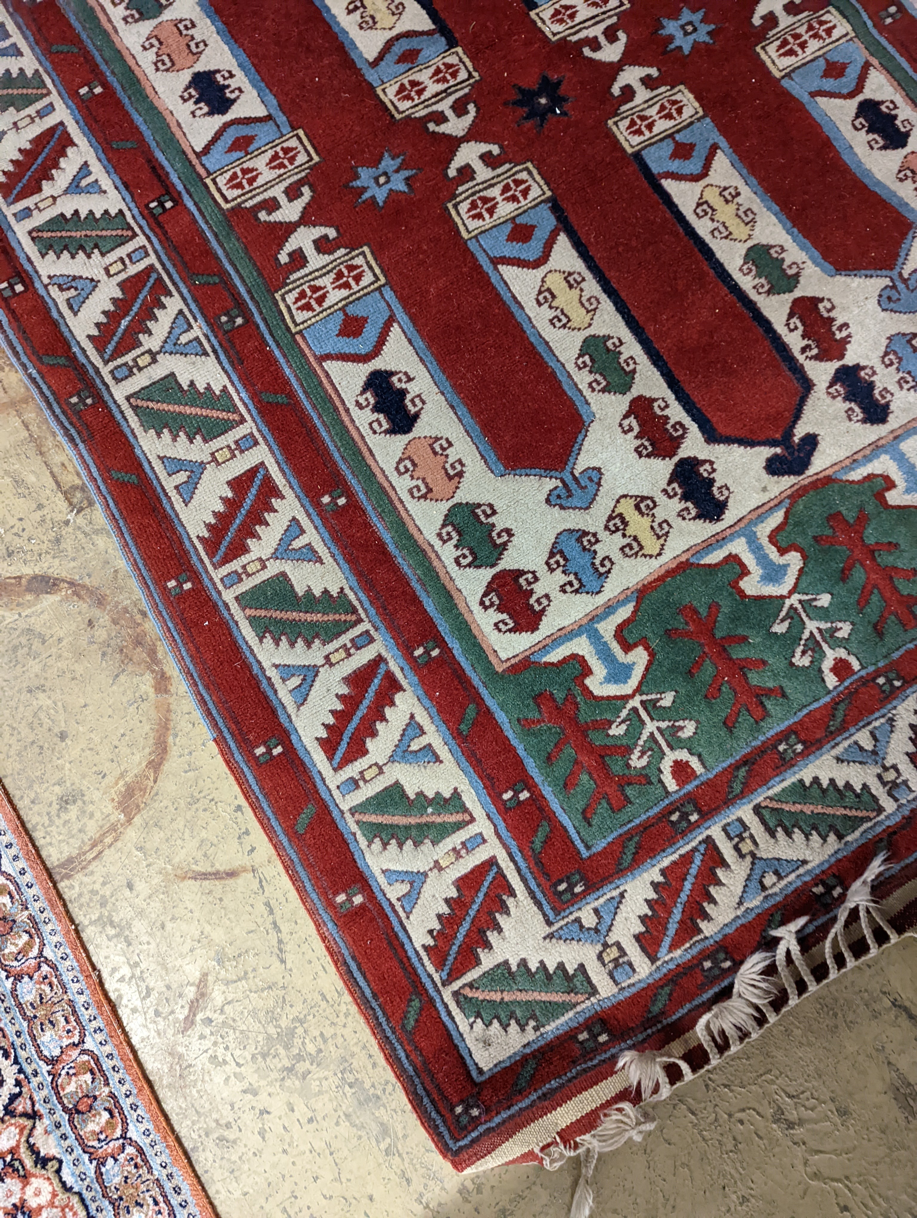 Two Turkish rugs and a Persian rugs. Largest, 284x172cm.